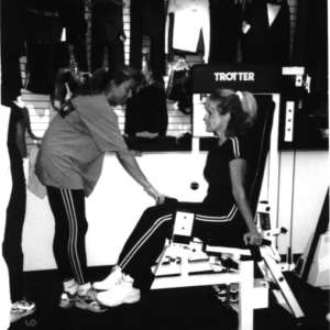 Kelly trains Laurie on some of our first strength equipment